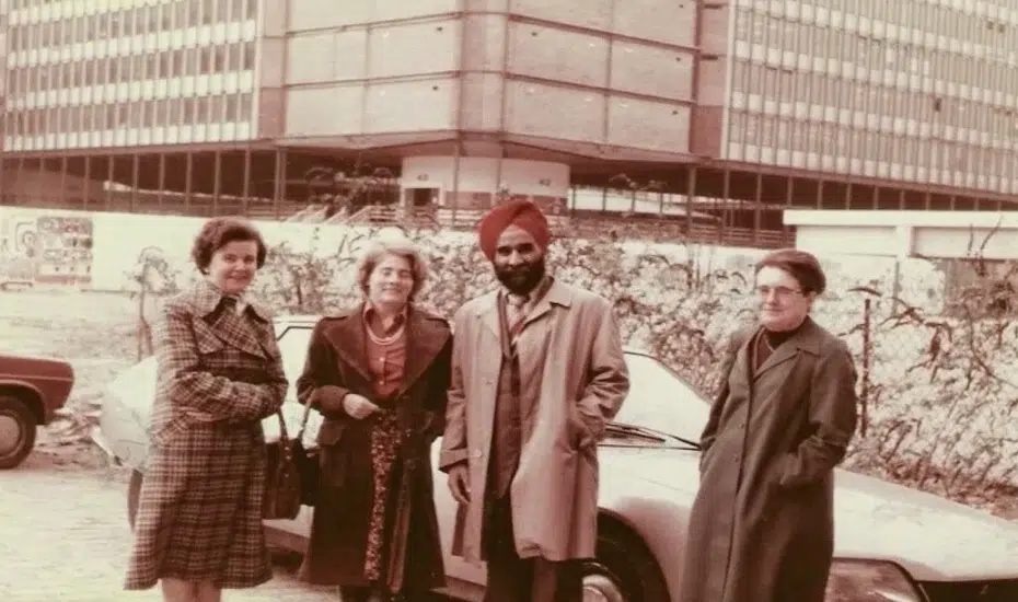 Hardev Singh Virk standing with his research group in front of a car at Marie Curie University, Paris (1977)